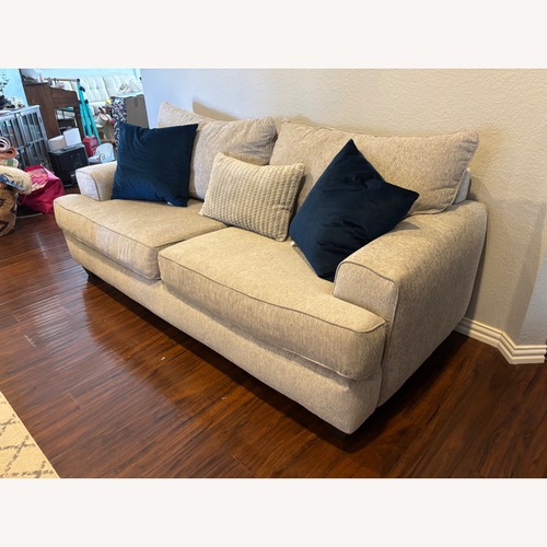 Used Rooms To Go  East Bank Light Gray Loveseat for sale on AptDeco