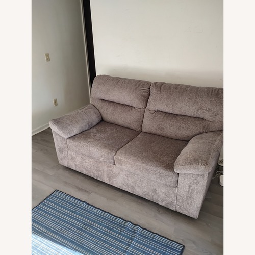 Used Ashley Furniture Dark Gray Fabric Loveseat for sale on AptDeco