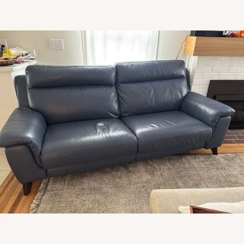 Used Living Spaces Moana Blue Leather Reclining Sofa for sale on AptDeco