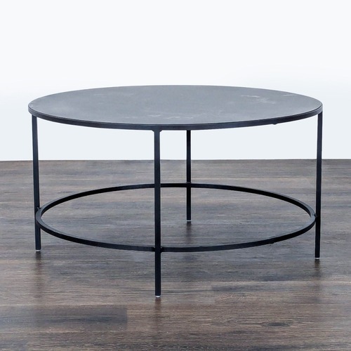 Used Room & Board Slim Round Coffee Table for sale on AptDeco
