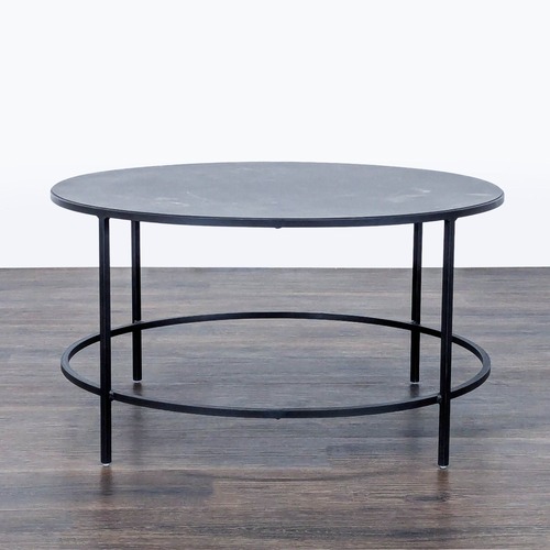 Used Room & Board Slim Round Coffee Table for sale on AptDeco
