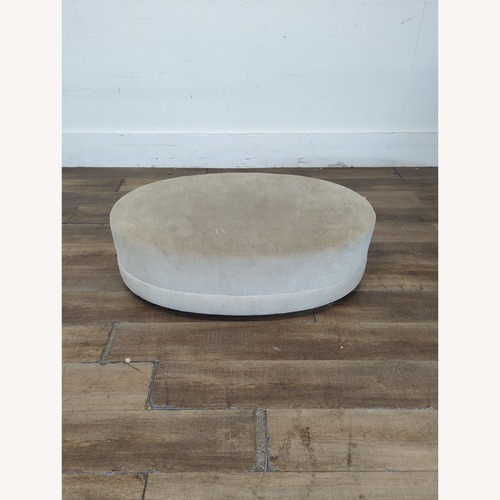 Used Oval Fabric Covered Ottoman for sale on AptDeco