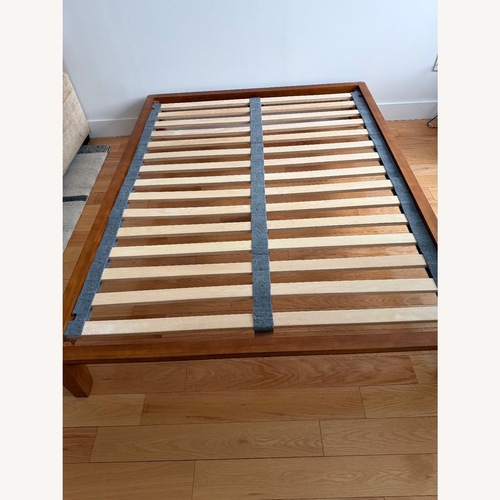 Used Thuma Dark Brown Wood Queen Bed for sale on AptDeco