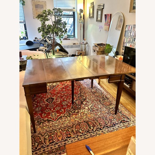 Used Vintage/Antique Dark Brown Wood Dining Table for sale on AptDeco