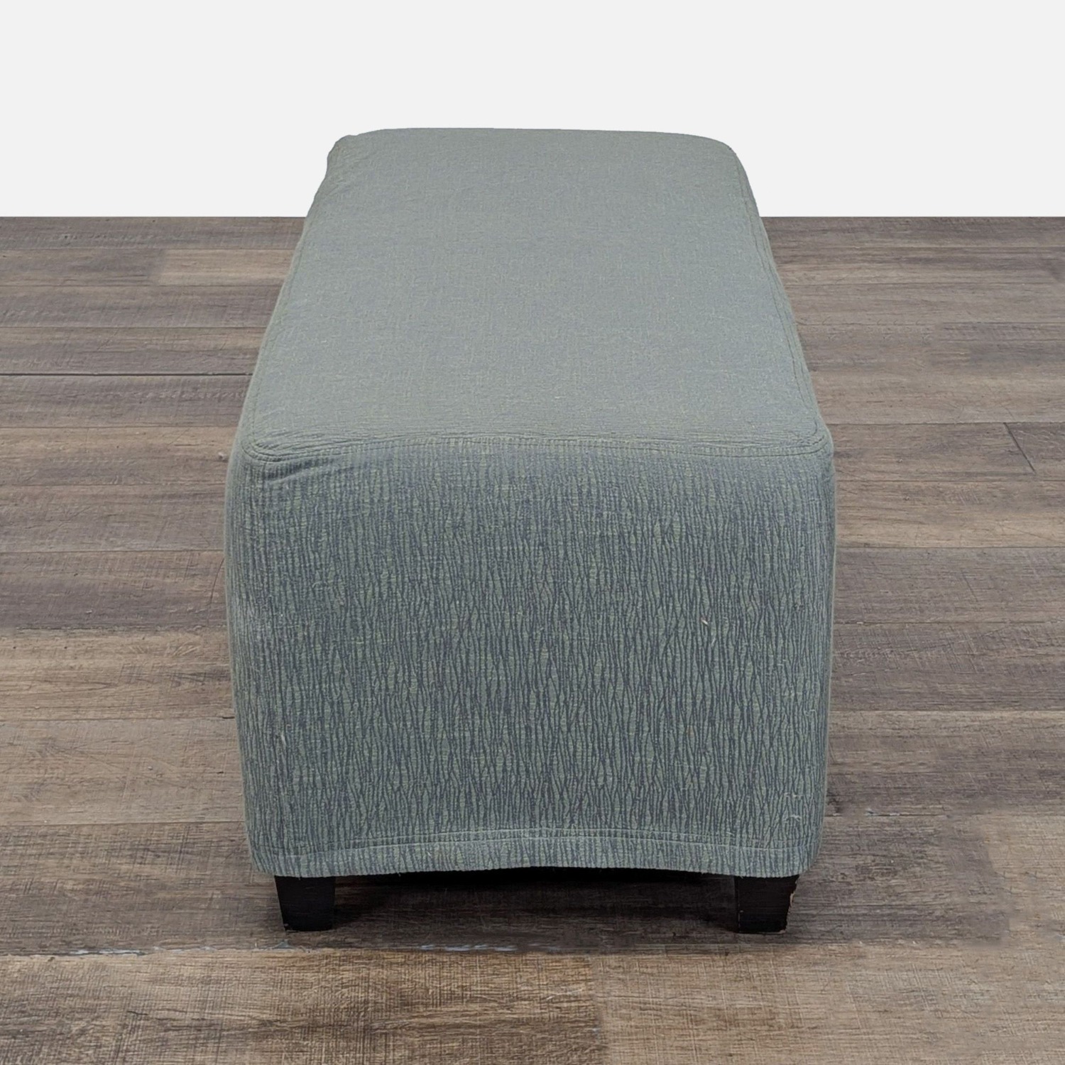 Slip Covered Ottoman on Wood Feet	 - image-2