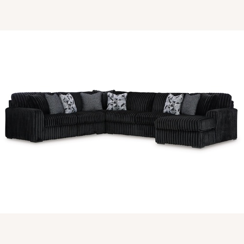 Used Midnight-Madness 4-Piece Sectional with Chaise for sale on AptDeco