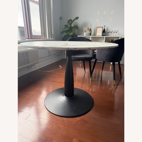 Used White Wood Dining Table with Marble Finish  for sale on AptDeco