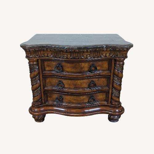 Used Heavily Carved Nightstand with Marble Top	 for sale on AptDeco