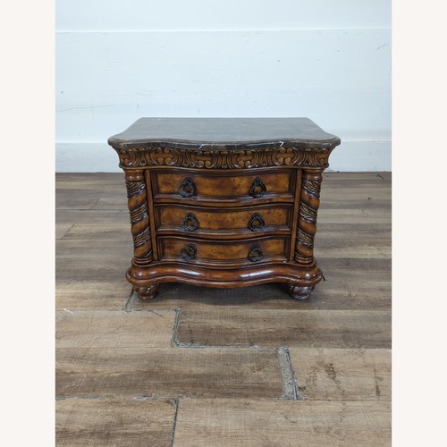 Used Heavily Carved Nightstand with Marble Top	 for sale on AptDeco