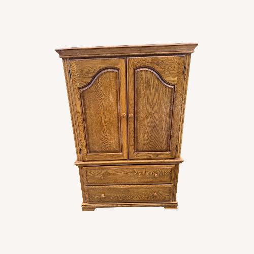 Used Wooden Clothing Armoire for sale on AptDeco