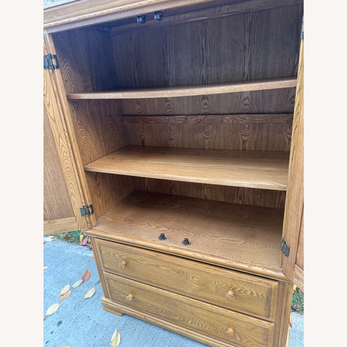Used Wooden Clothing Armoire for sale on AptDeco
