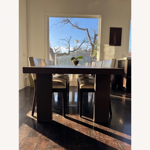 Used Dark Brown Wood Dining Table for sale on AptDeco