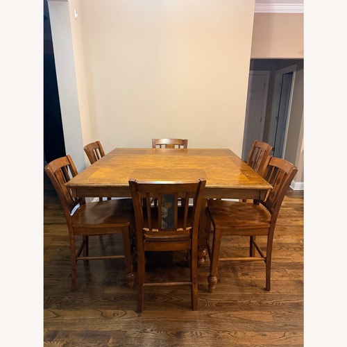 Used Natural Wood Dining Table and Chairs for sale on AptDeco