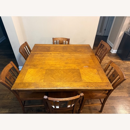 Used Natural Wood Dining Table and Chairs for sale on AptDeco