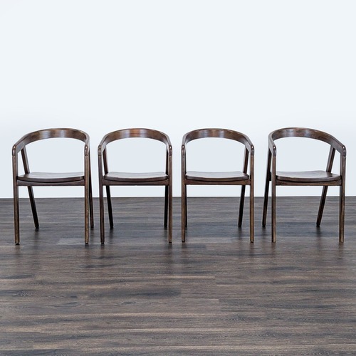 Used Set of Four Wood Dining Chairs with Curved Back	 for sale on AptDeco