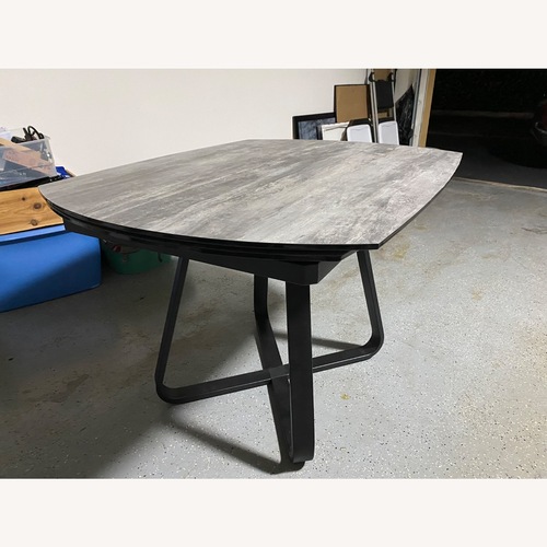 Used Wood Grain Ceramic Top Expendable Dining Table for sale on AptDeco