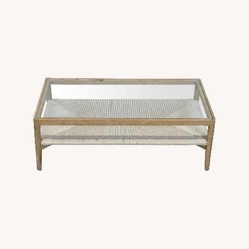 Used Glass Top Wood Coffee Table with Woven Shelf	 for sale on AptDeco