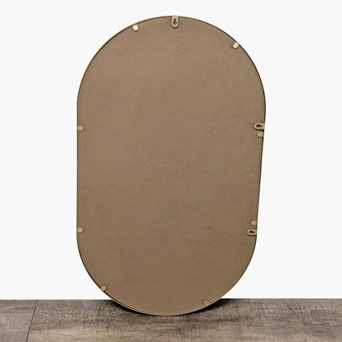 Used Metal Framed Oval Mirror for sale on AptDeco