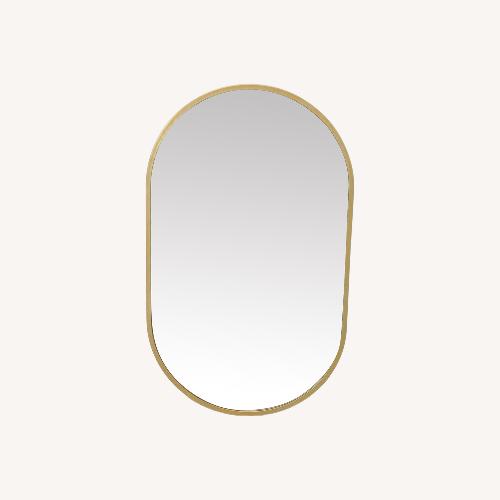 Used Metal Framed Oval Mirror for sale on AptDeco
