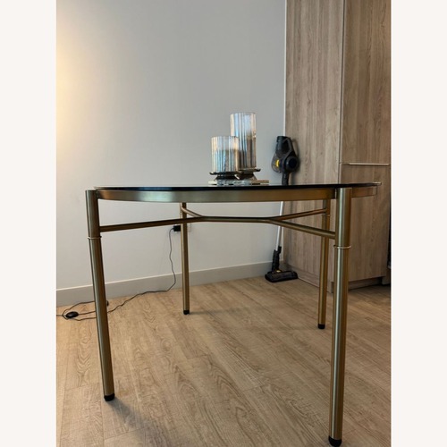 Used Smoked Glass Top Dining Table for sale on AptDeco