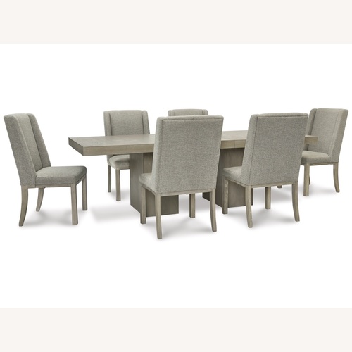 Used Fawnburg Dining Table with Extension + 6 Chairs for sale on AptDeco