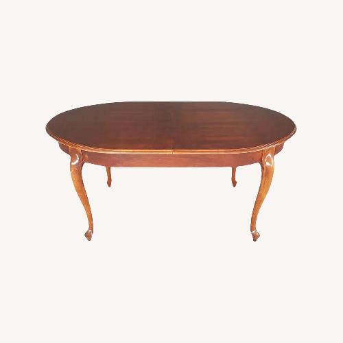 Used Oval French Oak Extendable Dining Table  for sale on AptDeco