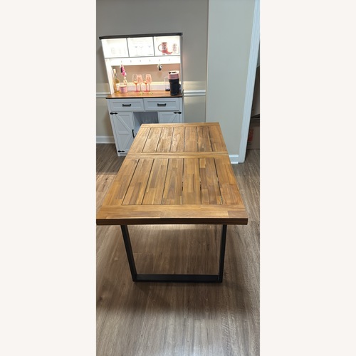 Used Dark Brown Wood Dining Table for sale on AptDeco