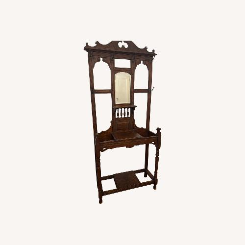 Used Vintage/Antique Dark Brown Wood Coat Rack for sale on AptDeco