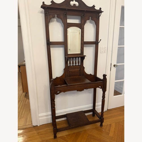 Used Vintage/Antique Dark Brown Wood Coat Rack for sale on AptDeco