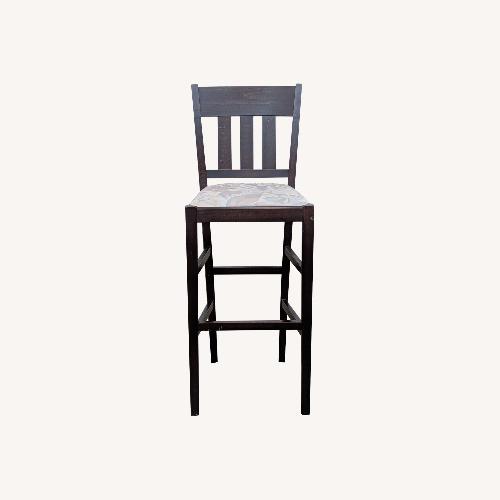 Used Wooden Bar Stool with Padded Seat	 for sale on AptDeco