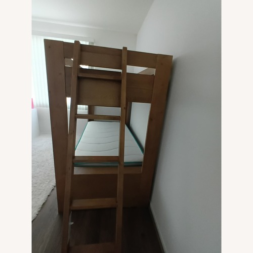 Used Living Spaces Natural Wood Bunk Bed for sale on AptDeco