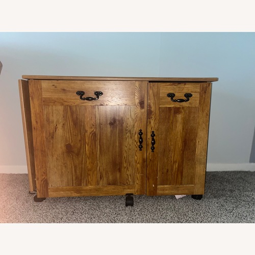 Used Dark Brown Wood Armoire for sale on AptDeco