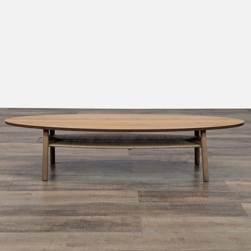Used Oval Wood Coffee Table with Shelf	 for sale on AptDeco