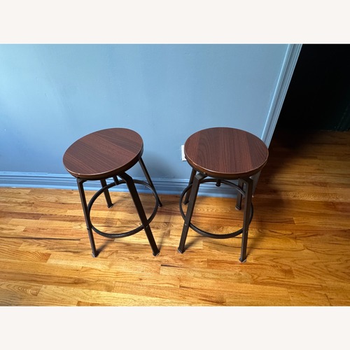Used Wooden Industrial Swivel Bar Stools for sale on AptDeco