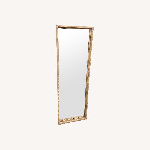 Used Uttermost Natural Rattan Floor Mirror for sale on AptDeco