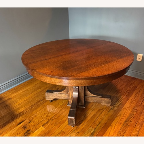 Used Antique Round Wood Dining Table for sale on AptDeco