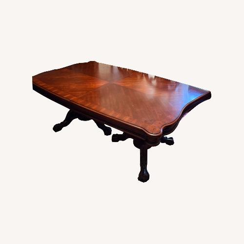 Used Ashley Furniture Red Wood Dining Table for sale on AptDeco