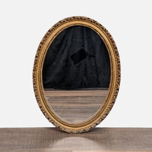 Used Art Light Company Carved Oval Mirror for sale on AptDeco