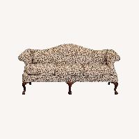 Camelback Sofa With Floral Upholstery	