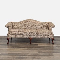 Camelback Sofa With Floral Upholstery	