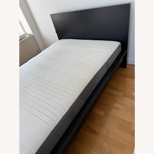 Used IKEA Malm Dark Brown Wood Queen Bed for sale on AptDeco