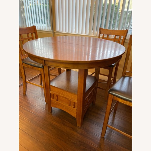 Used Wood look Dining Table and Chairs for sale on AptDeco