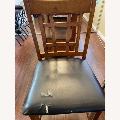 Used Wood look Dining Table and Chairs for sale on AptDeco