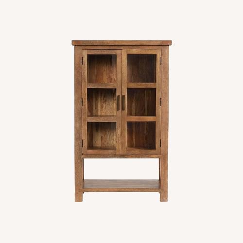 Used Pottery Barn Reed Storage Cabinet for sale on AptDeco