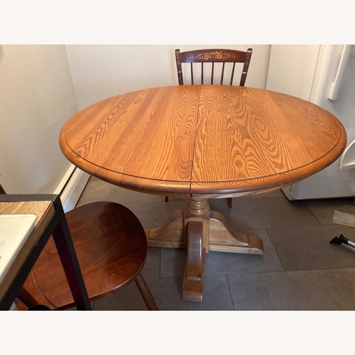 Used Vintage/Antique Dark Brown Wood Dining Table for sale on AptDeco
