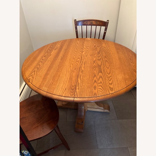 Used Vintage/Antique Dark Brown Wood Dining Table for sale on AptDeco