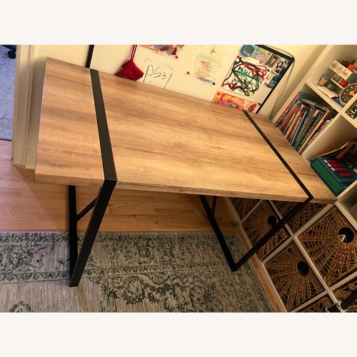 Used Safavieh Dining Table with Wood Top & Metal Base for sale on AptDeco