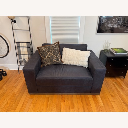 Used Pottery Barn Carmel Blue Leather Loveseat for sale on AptDeco