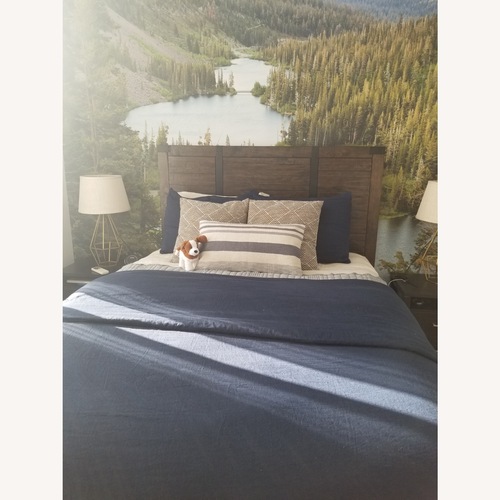 Used Raymour & Flanigan Dark Brown Wood Queen Bed for sale on AptDeco