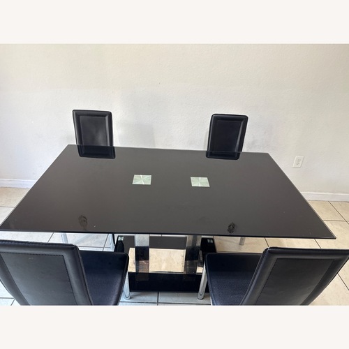 Used Black Glass Dining Table for sale on AptDeco